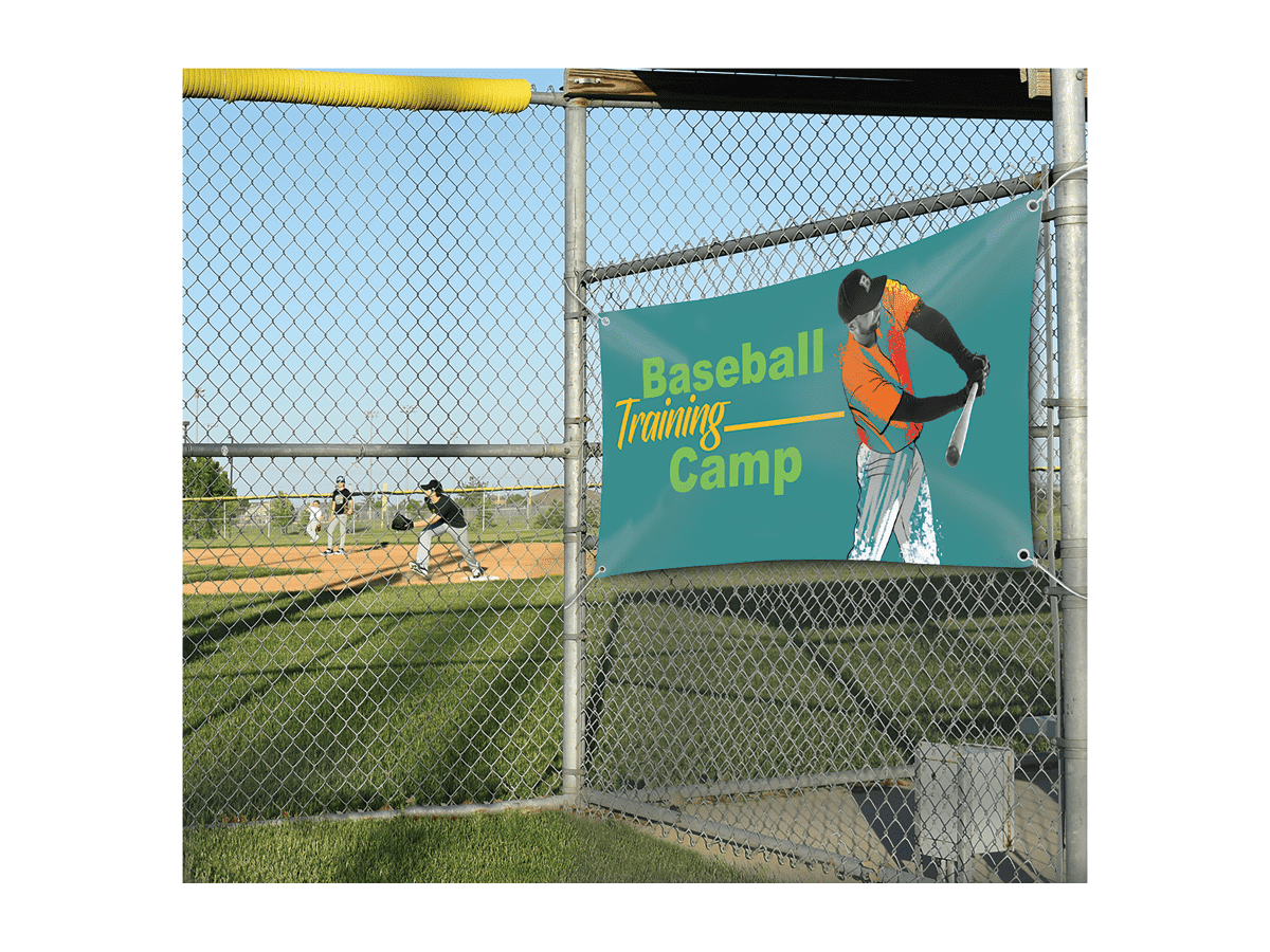 Printed outdoor banner hung on a chain-link fence